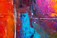 这是一幅色彩缤纷的抽象表现主义画作，画布上纹理充满活力，色调大胆