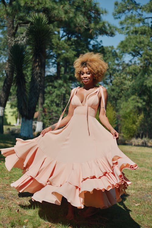 Model in a Pink Cocktail Dress in the Park