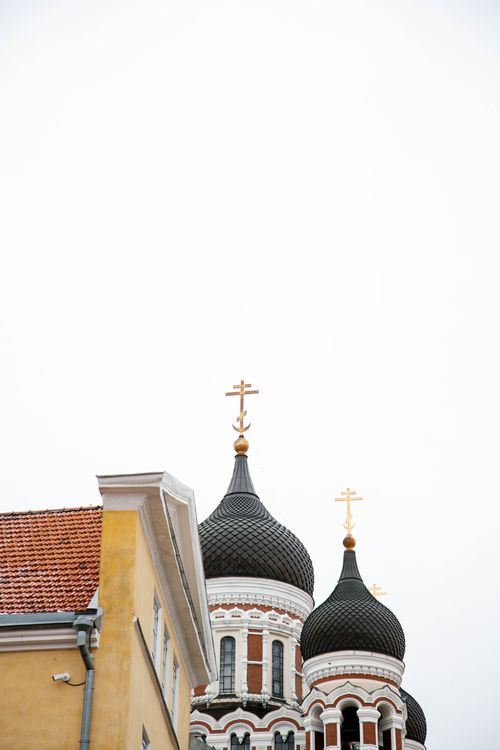 Free Vertical shot of Orthodox church domes with crosses against a clear sky, capturing architectural beauty. Stock Photo