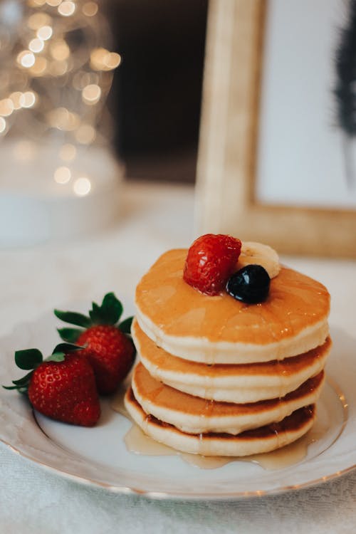 Free Pancakes with Honey and Strawberries Stock Photo
