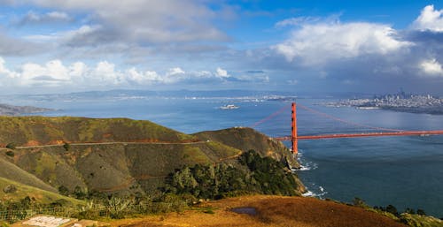 A view of the golden gate bridge from a hill