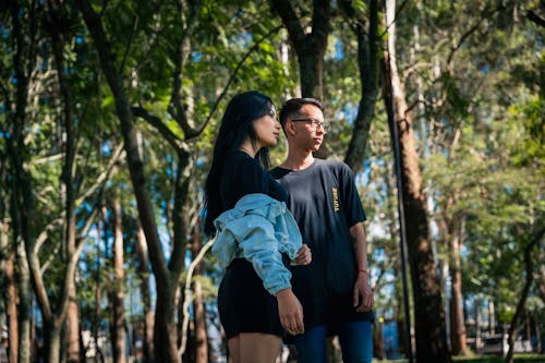 Young Couple Standing Close in Park