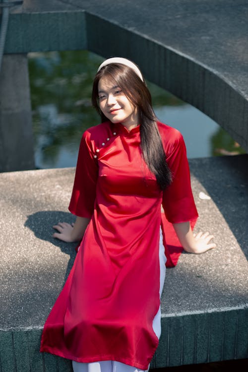 Young Brunette Woman in Red Traditional Dress