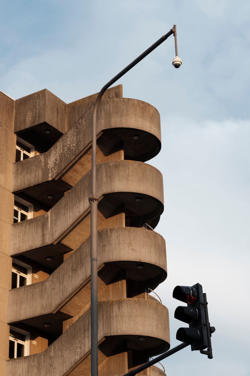 Ribbed concrete balconies on a brutalist block — Samuel Jeronimo on Pexels