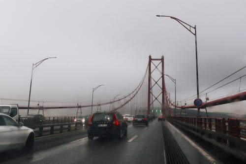 Cars on Bridge in Rain