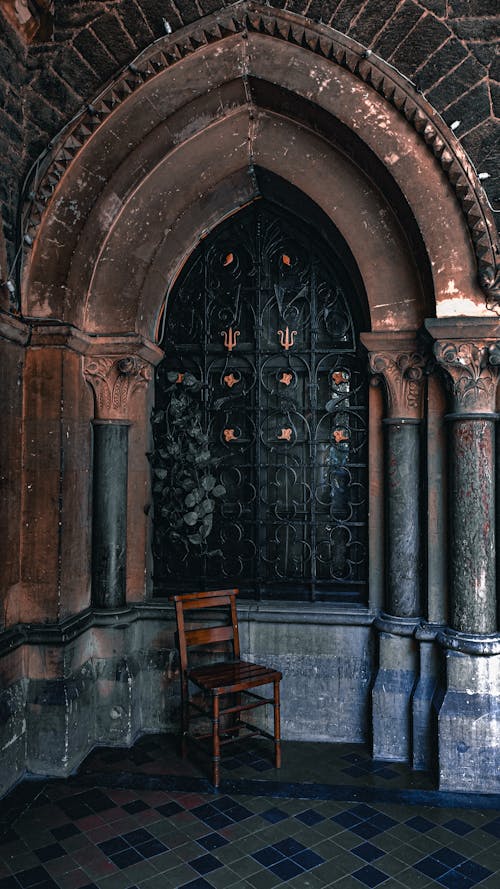 Wooden Chair in Gothic Niche by Window
