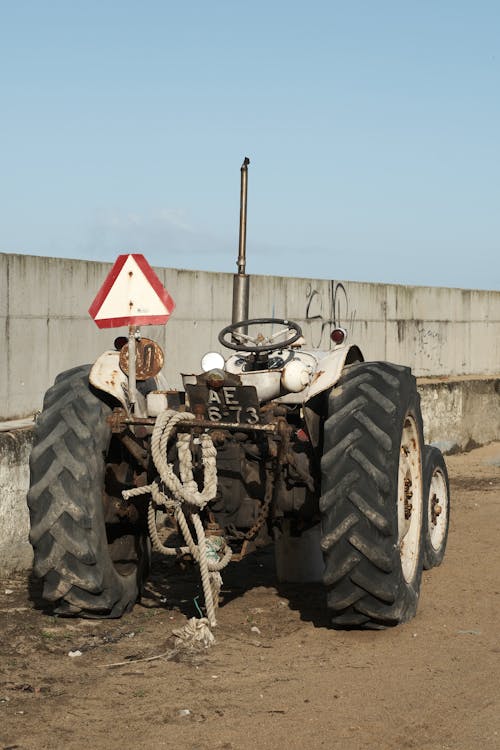 Photo of a Tractor on a Dirt Road 