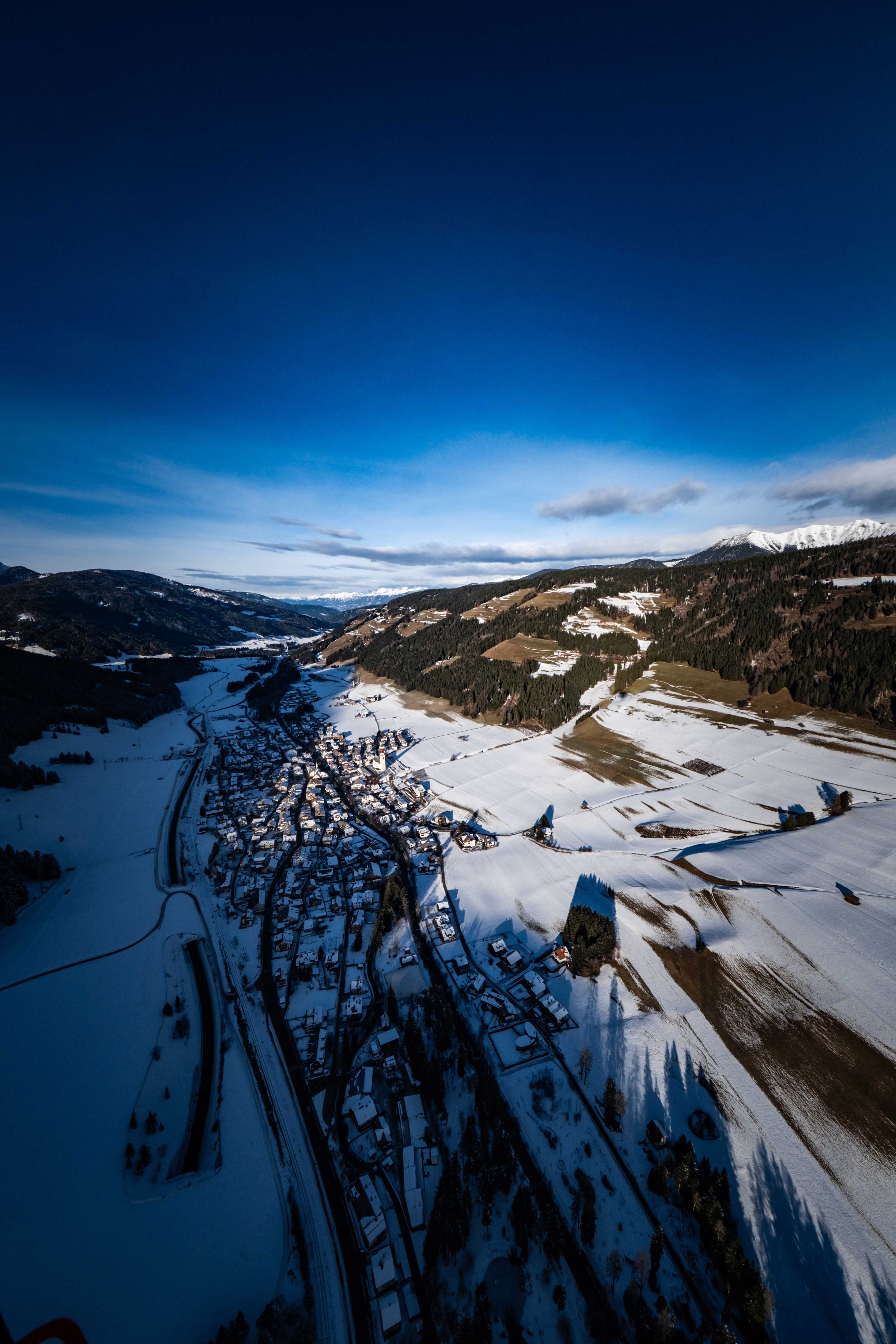 Aerial view of a snowy village in the mountains · Free Stock Photo
