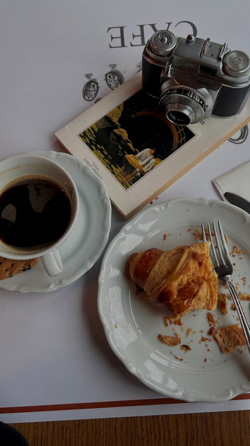 Croissant, Coffee, Camera and Book