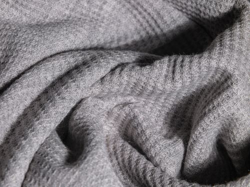 Free Close-up image of soft gray knitted fabric with intricate texture. Stock Photo