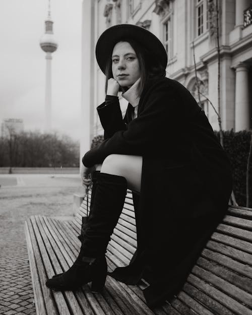 Stylish Woman Sitting on Bench