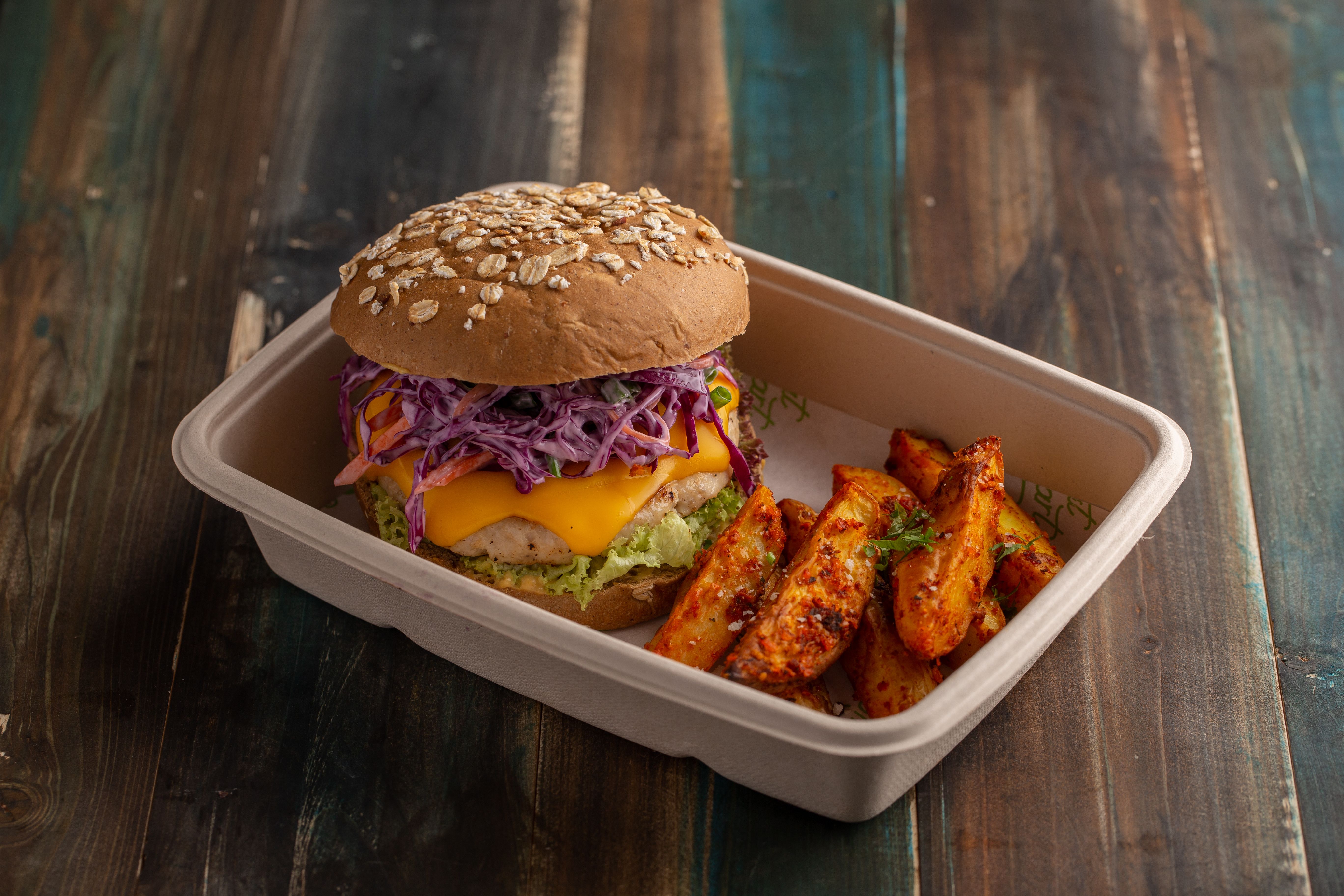 Chinese chicken burgers with rainbow sesame slaw stacked and ready to eat