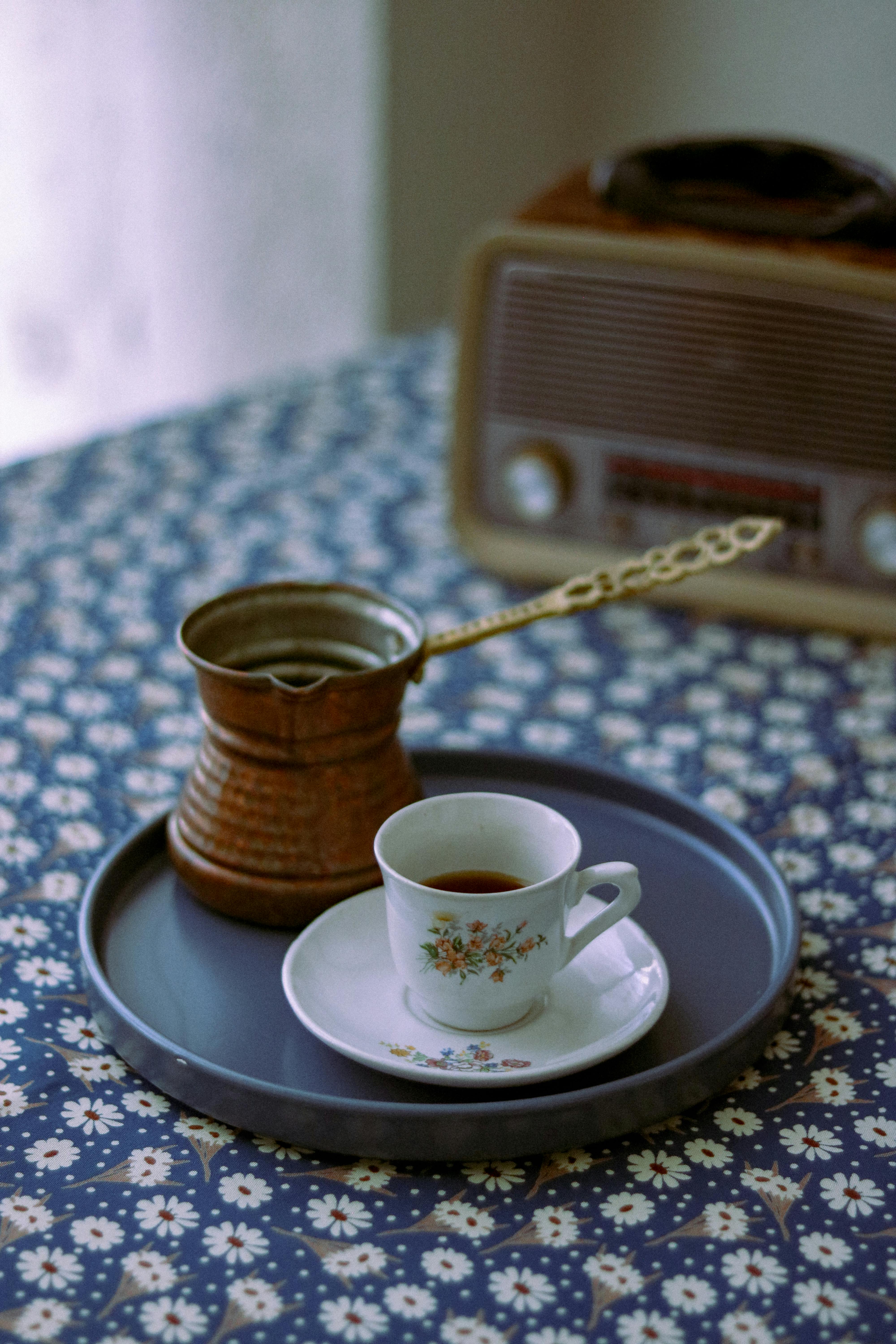 coffee pot and cup of coffee on tray