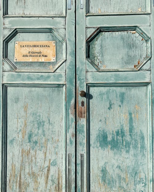 Close-up of Old Wooden Door with a Note 