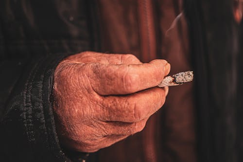 Elderly Man Smoking a Cigarette 