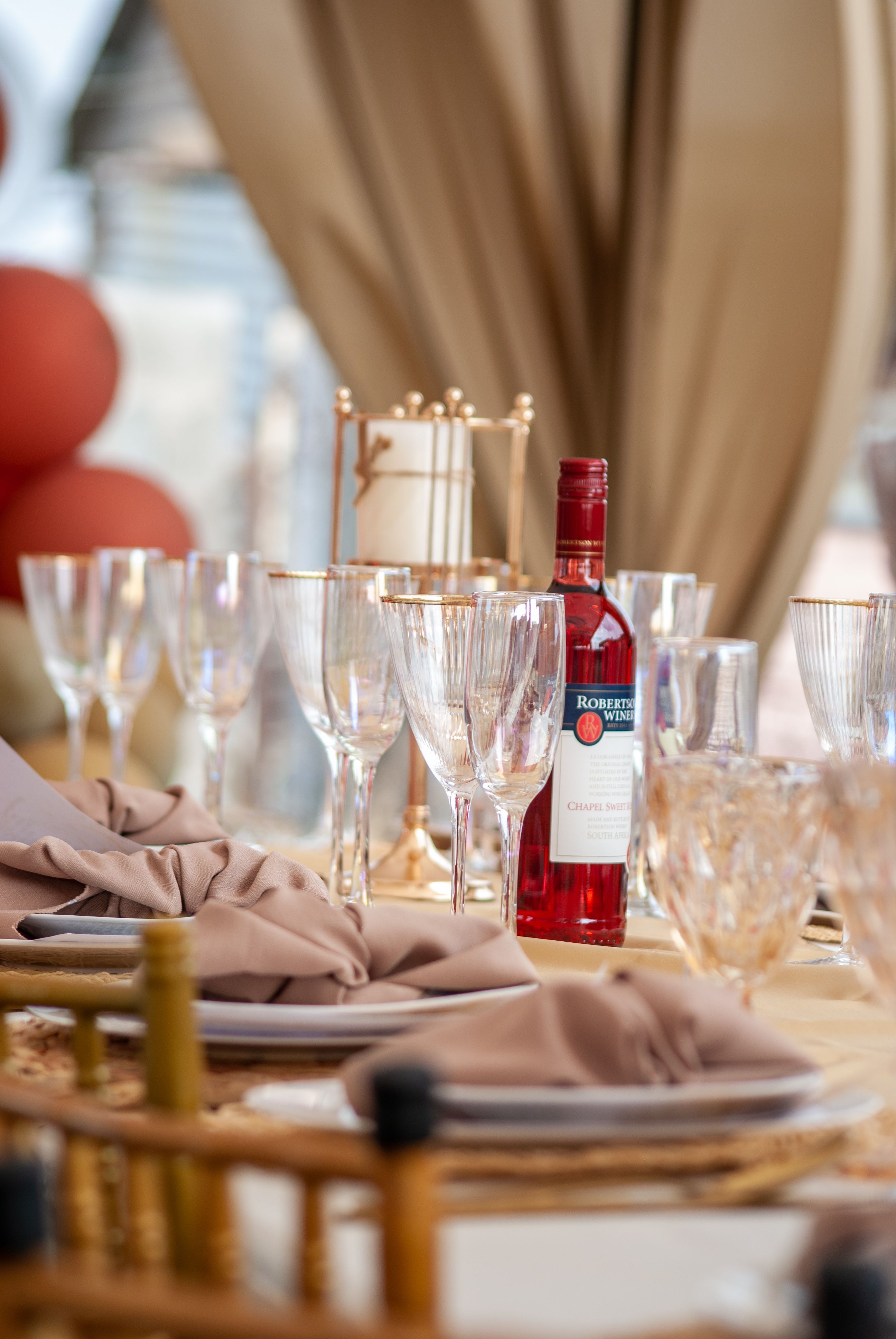 Chic table arrangement with elegant wine display, perfect for celebrations and gatherings.
