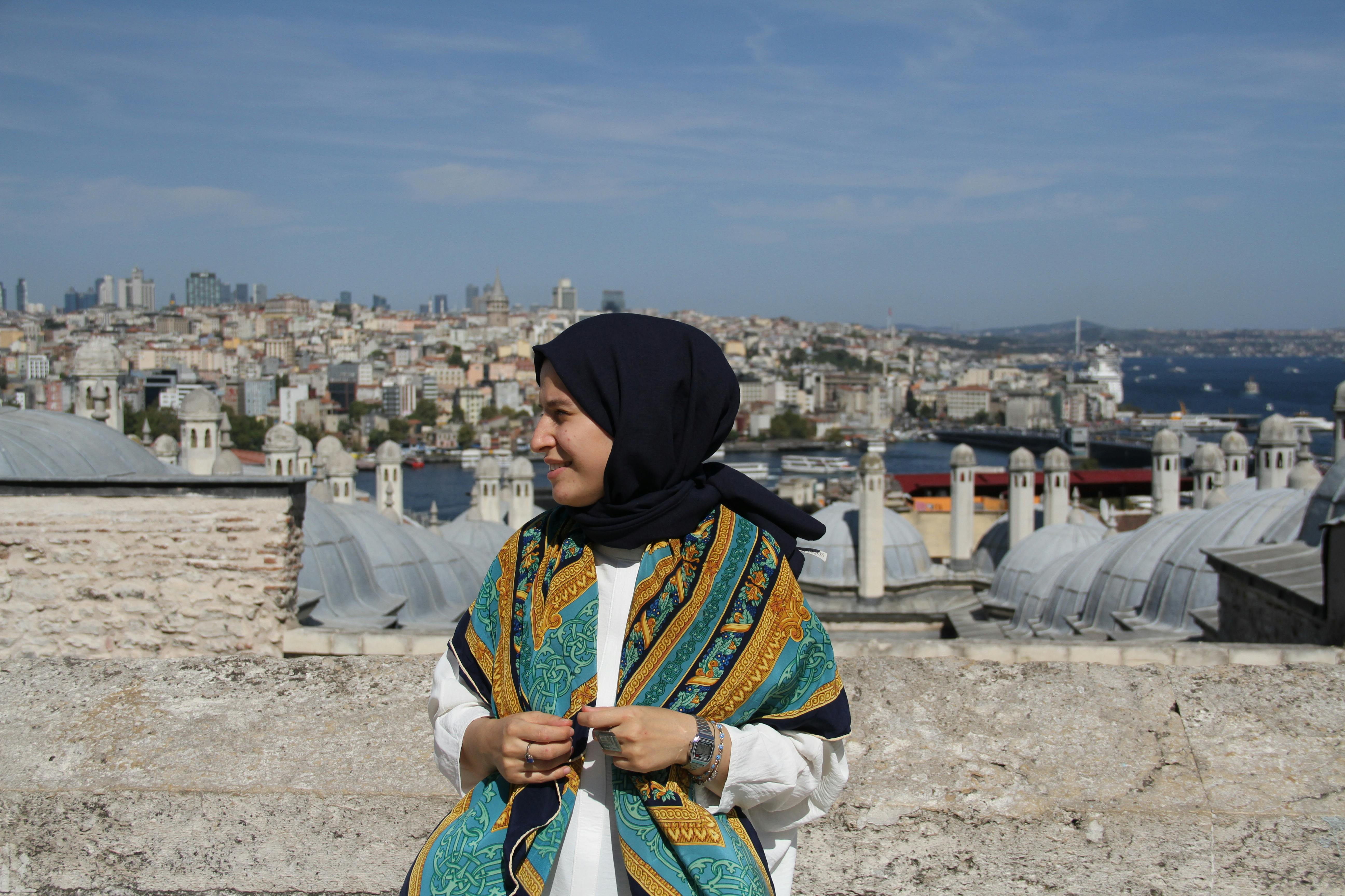 portrait of woman in traditional clothing at suleymaniye mosque in istanbul