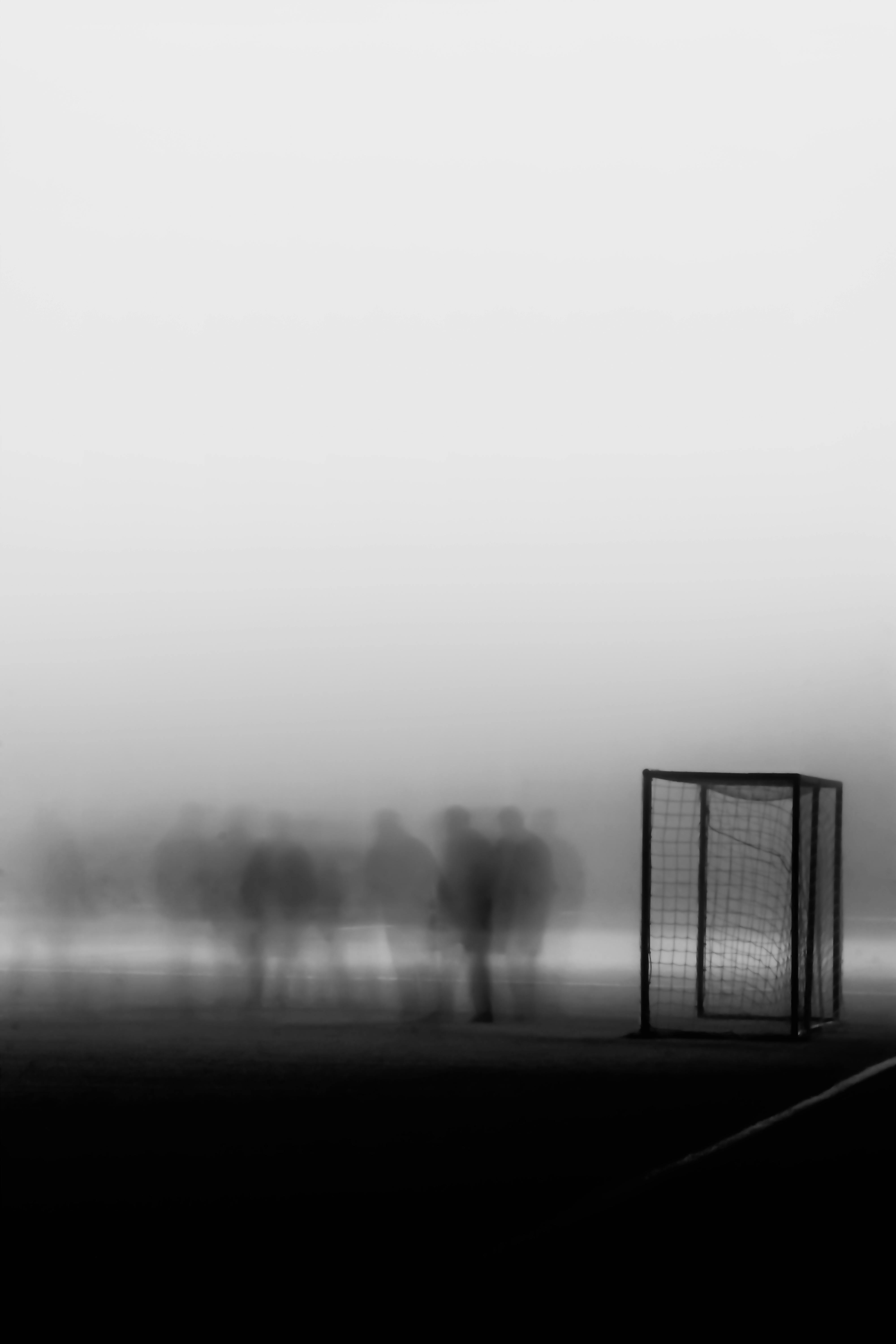 fog over blurred people on soccer pitch