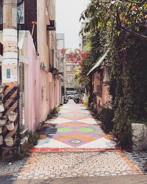A colorful alleyway with a colorful pattern on the ground