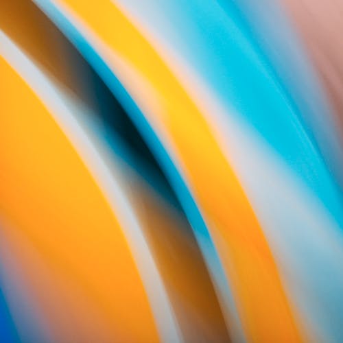 Abstract blurred background with yellow, blue and orange colors