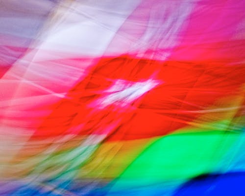 A blurry image of a colorful flag