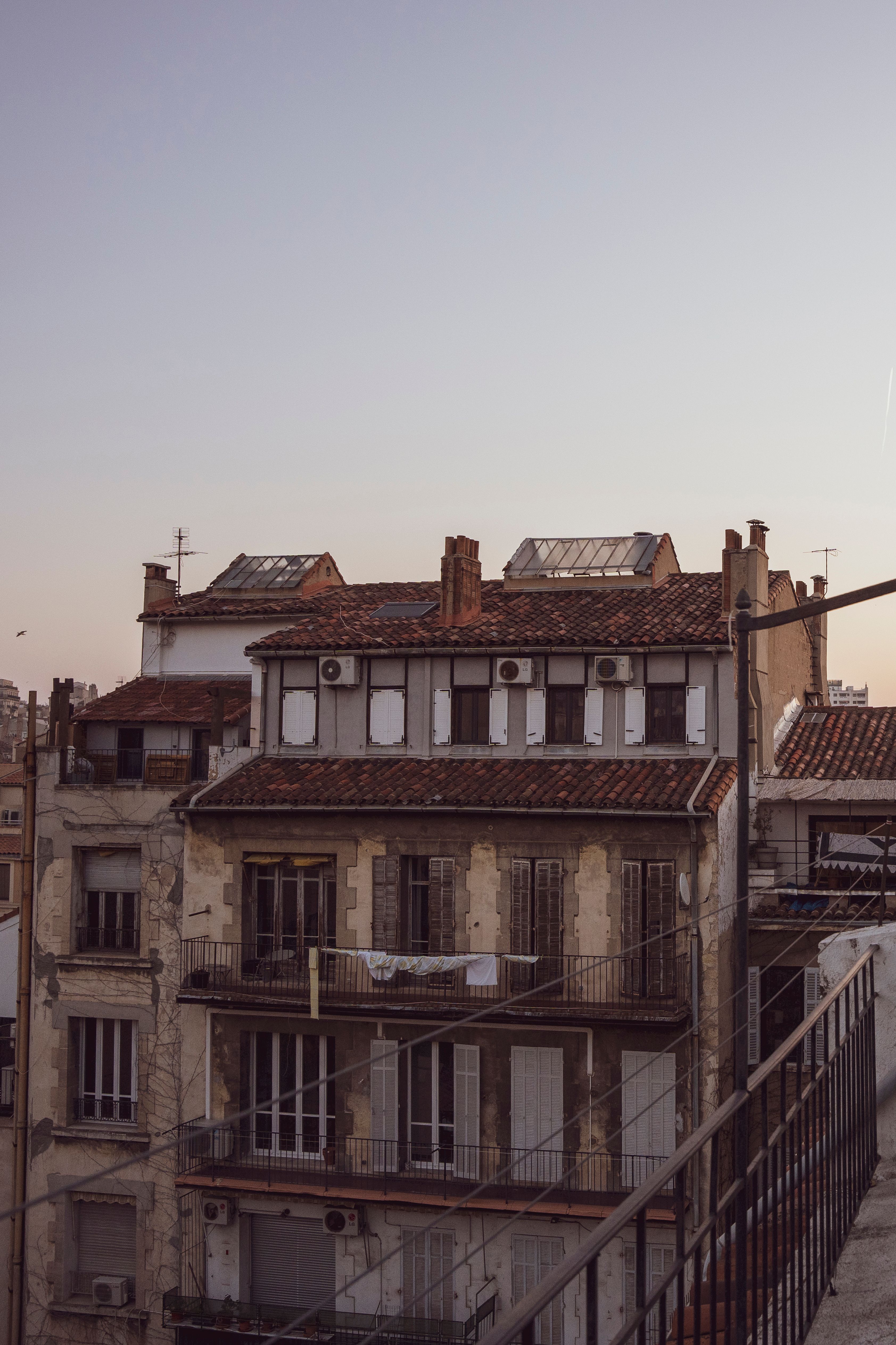 A vintage building in an urban setting captured at sunset, showcasing charming architecture.