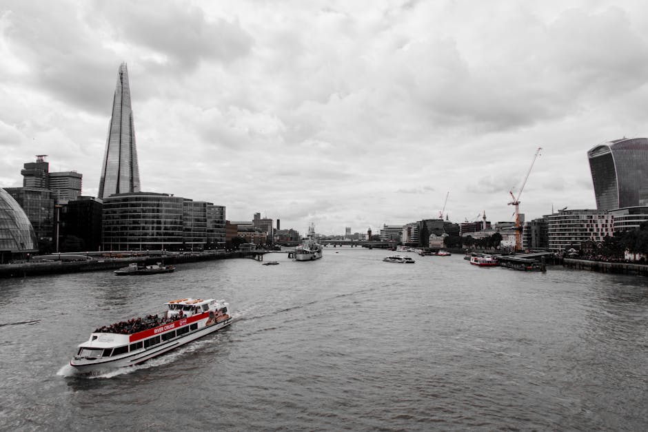 A boat is traveling down the river in london