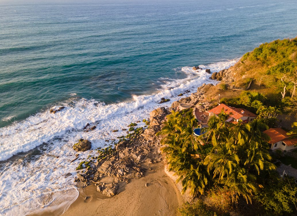 House with a Swimming Pool by the Ocean