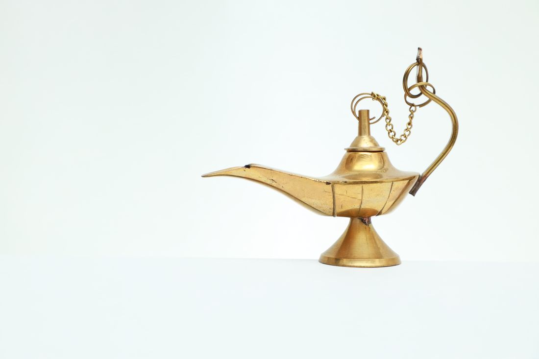 Brass chirag oil lamp on a white background