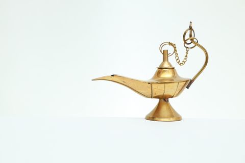 Brass chirag oil lamp on a white background