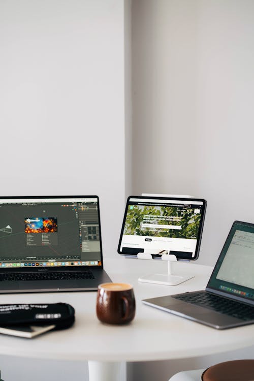 Laptops and Tablet on Table