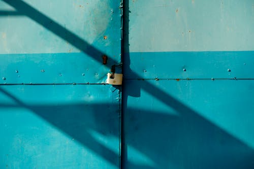 A blue door with a lock on it