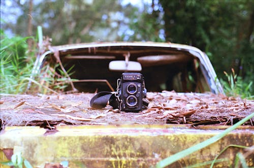 Vintage Camera on Car Wreckage