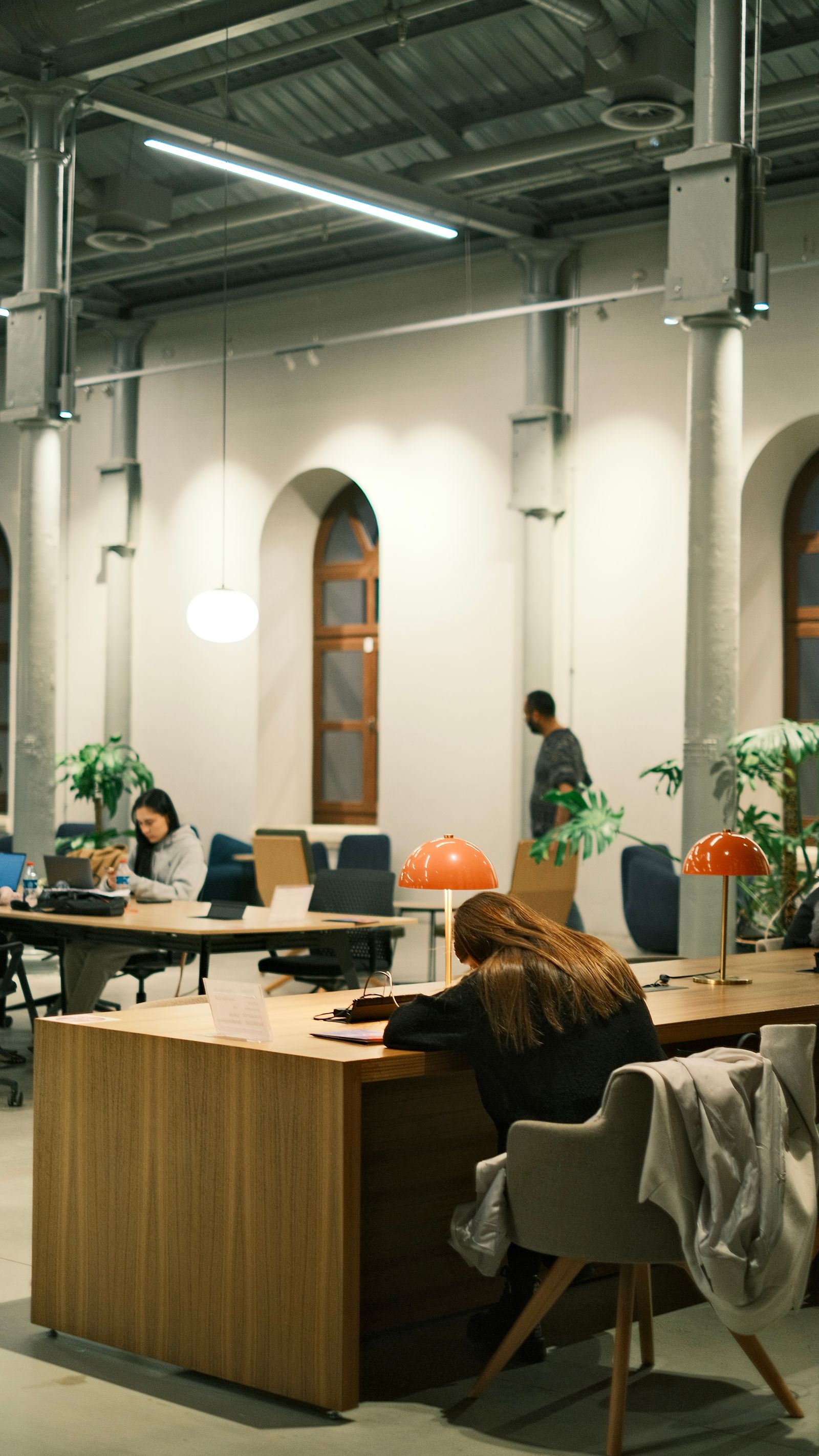 Bright coworking lounge with desks and chairs