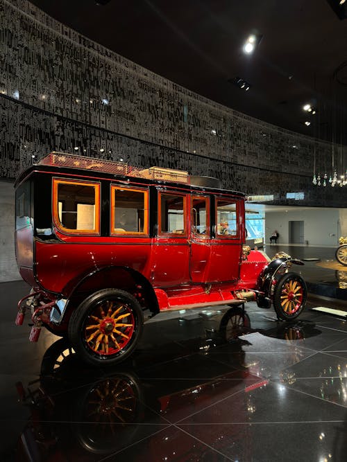 An antique car is on display in a museum