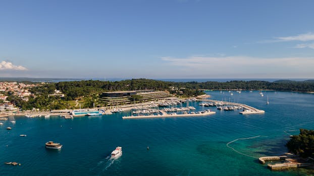 The marina in croatia is surrounded by blue water