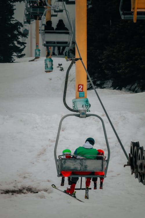 Father Sitting with Children on Ski Lift