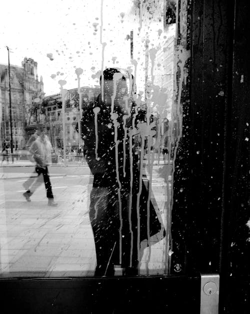 Person Standing behind Stained Window