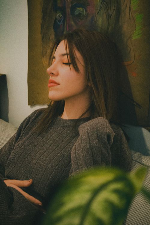 Free Portrait of a woman relaxing indoors in Ankara, Türkiye with eyes closed. Stock Photo