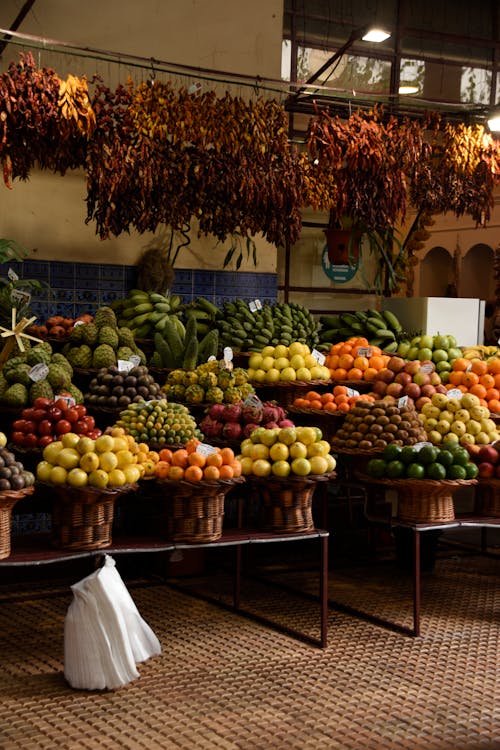 A fruit stand with many different types of fruit