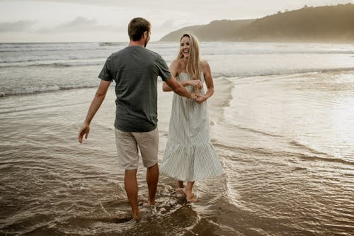 Serene Couple on Wet Beach
