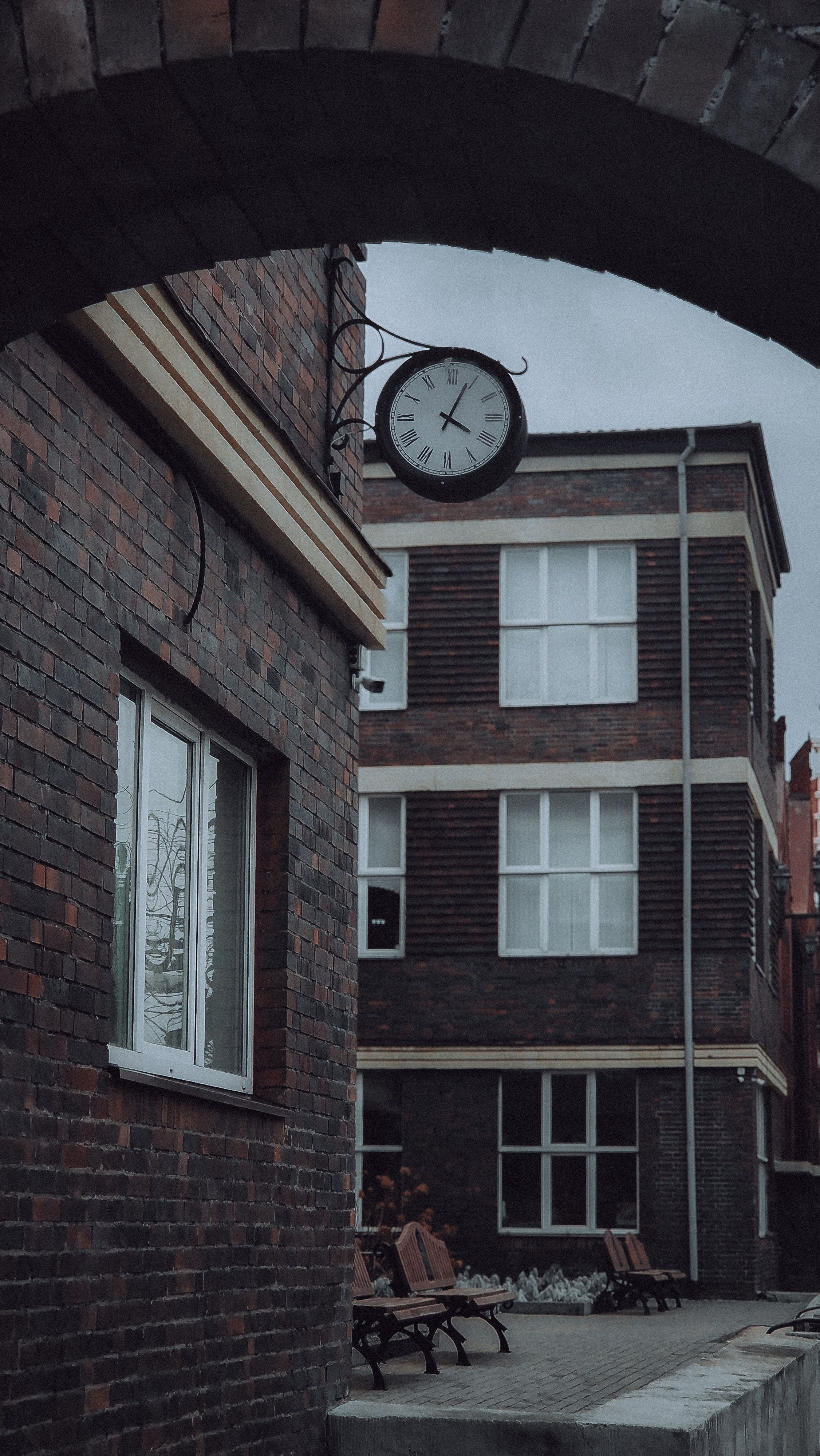 Clock on the Wall of a Brick Building · Free Stock Photo