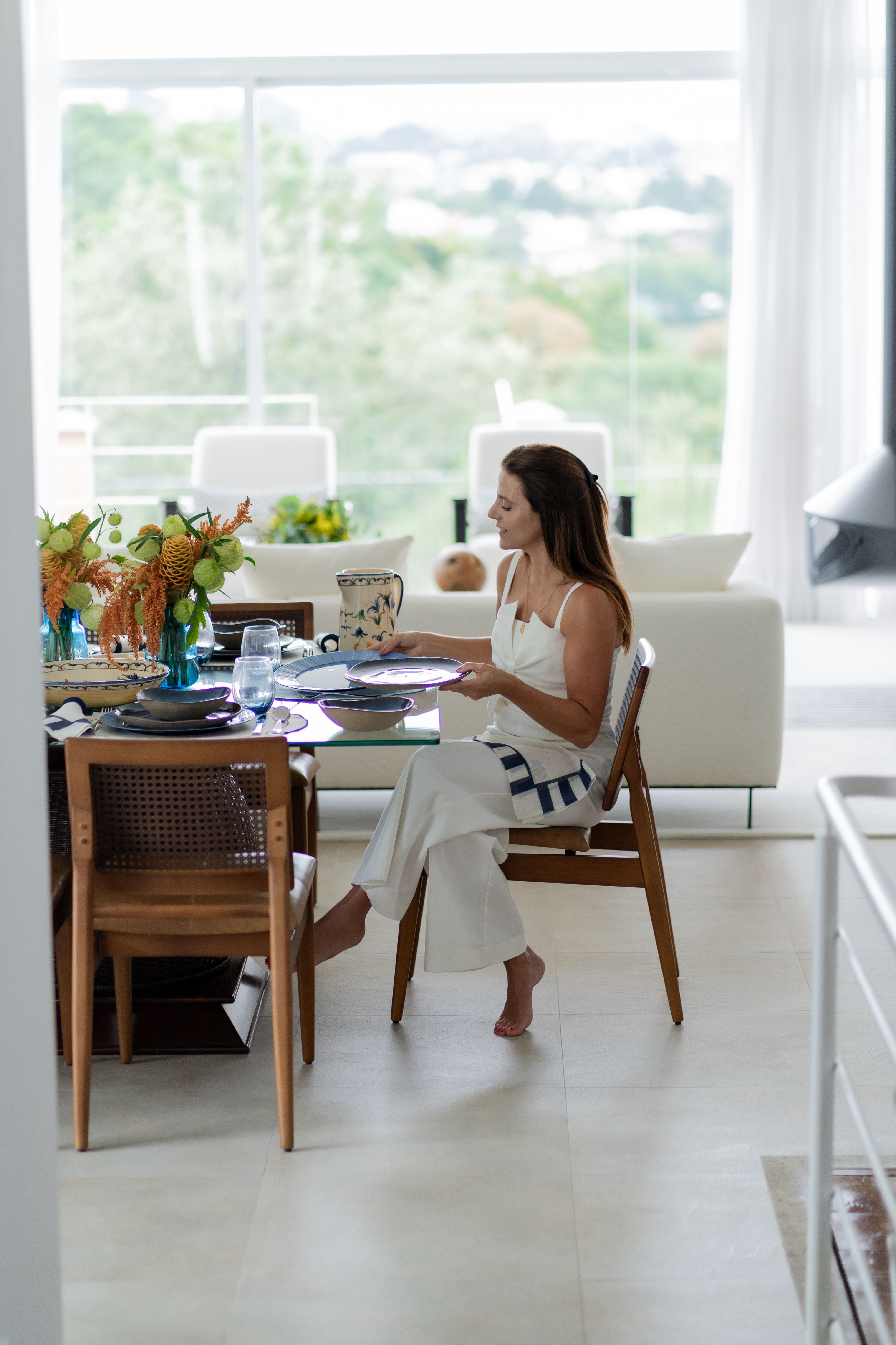 Woman Sits at Table with Traditional Pottery Dining Setting · Free ...