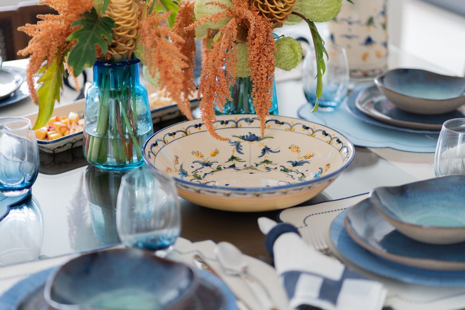 Charming table setup featuring elegant tableware and a floral centerpiece.