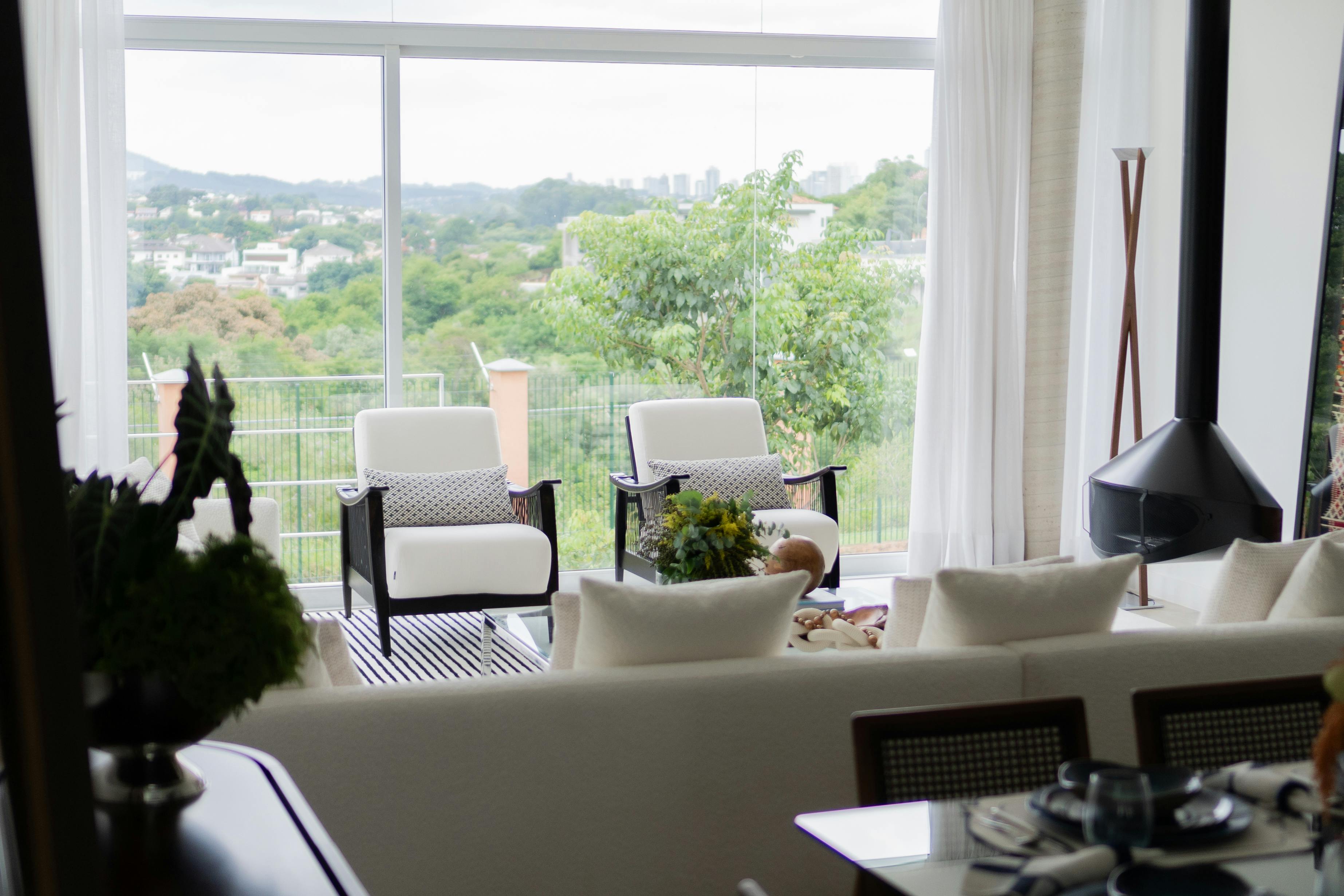 modern condo interior with large windows showing a territorial view - buy a condo in madison park wa