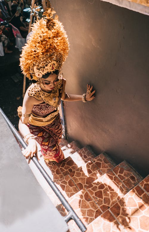 Woman Climbing Up The Stairs