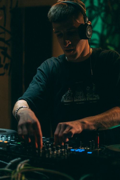 Free Energetic DJ spinning tracks at a lively nightclub in Lviv, Ukraine. Stock Photo