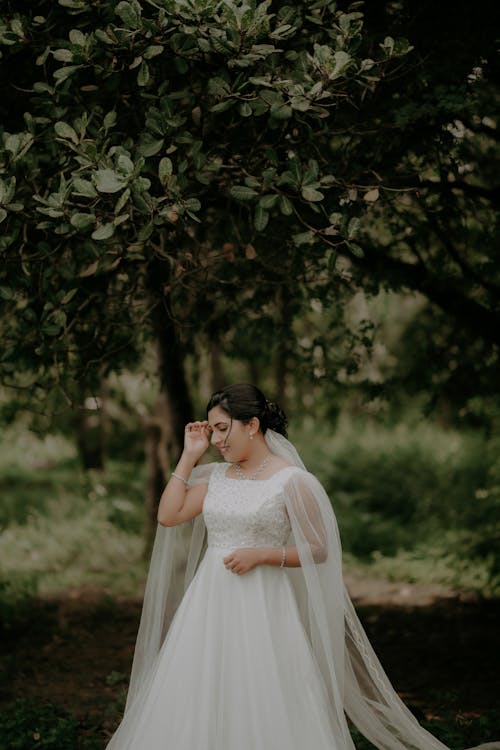 Bride in Wedding Dress in Forest