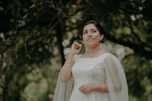 Portrait of Bride Standing in Wedding Dress