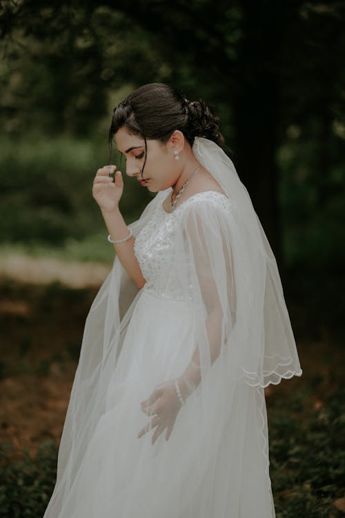 Bride in Wedding Dress Looking Down